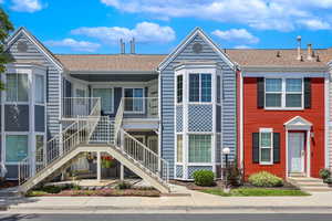 View of property featuring stairs