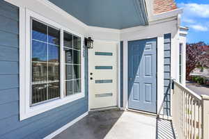View of exterior entry with covered porch