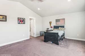 Bedroom with lofted ceiling, carpet, and recessed lighting