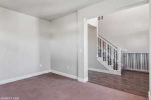 Spare room with carpet and stairs