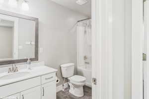 Full bath featuring vanity, tile patterned flooring, and shower / tub combo