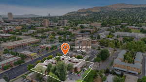 Aerial view of property's location featuring property boundaries highlighted and a mountainous background