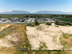 Aerial perspective of suburban area featuring a mountain backdrop
