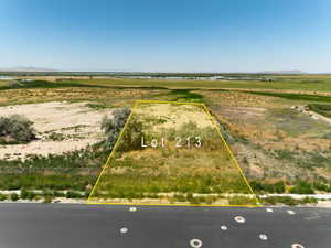 Aerial view of sparsely populated area with property boundaries highlighted and a water and mountain view