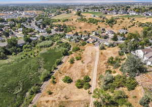Aerial overview of property's location featuring nearby suburban area
