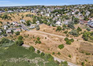 View of property location with nearby suburban area