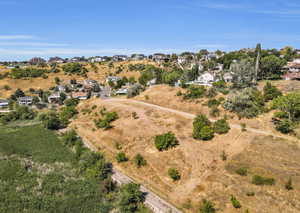 View of property location with nearby suburban area