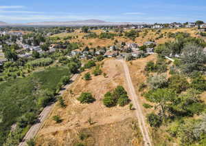 Aerial perspective of suburban area featuring a mountain backdrop