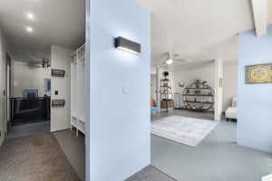 Entry Corridor with concrete flooring and recessed lighting