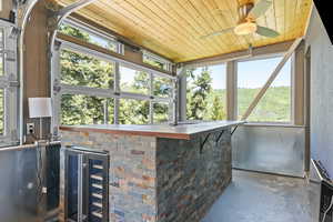 Sunroom featuring bartop