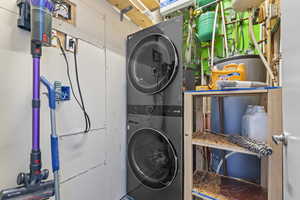 Washroom featuring estacked washer and dryer