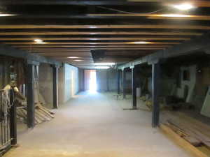 Unfinished ground level looking toward the back of the building.
