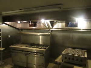 View of kitchen second level, Hood, oven range and grill.