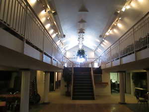 Stairway to third level dining and balcony.