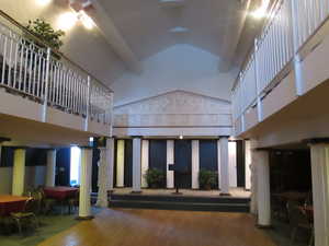 Second level event center with Greek theme. Hardwood dance floor and dining on both sides.
