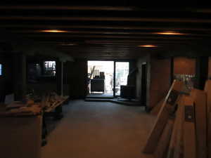 Unfinished ground level, bathrooms roughed in. Kitchen has been removed some of the cooking hood still intact.