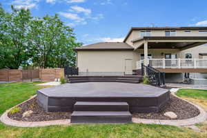 Back of house featuring a deck