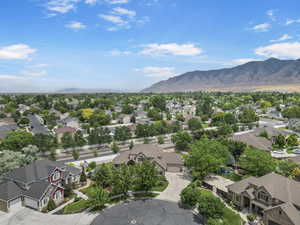 Aerial view of residential area featuring mountains