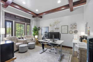 Office with glass doors and wooden beams