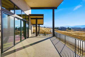 Balcony with a mountain view and a view of countryside