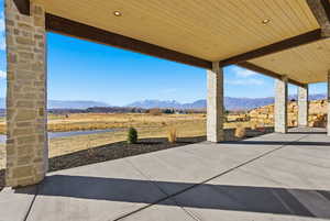 View of patio featuring a mountain view and a rural view