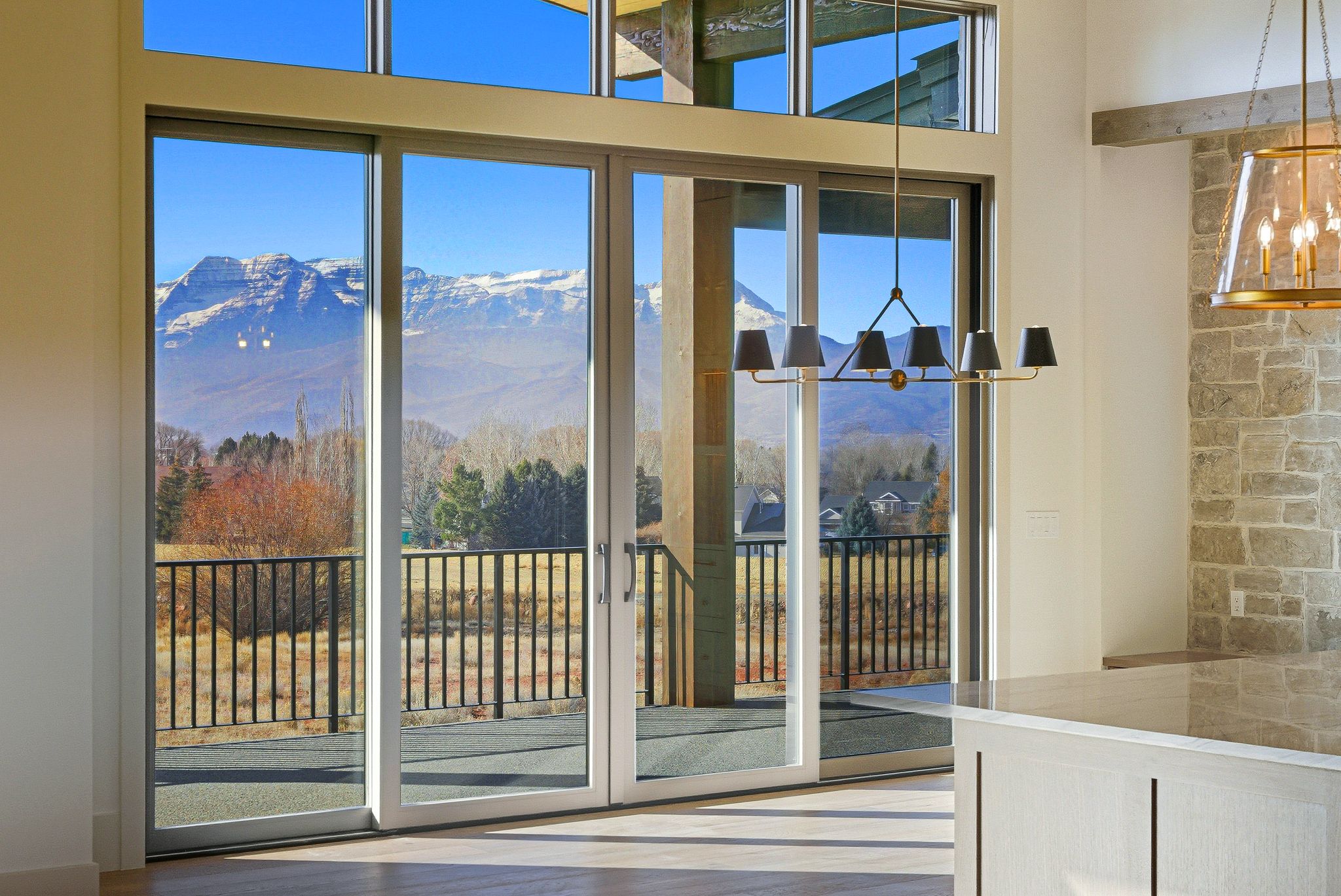 Doorway featuring a chandelier, a mountain view, and wood finished floors