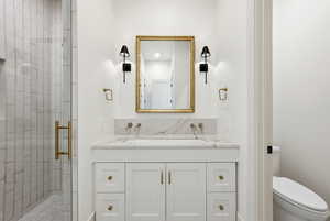 Bathroom with vanity and a shower stall