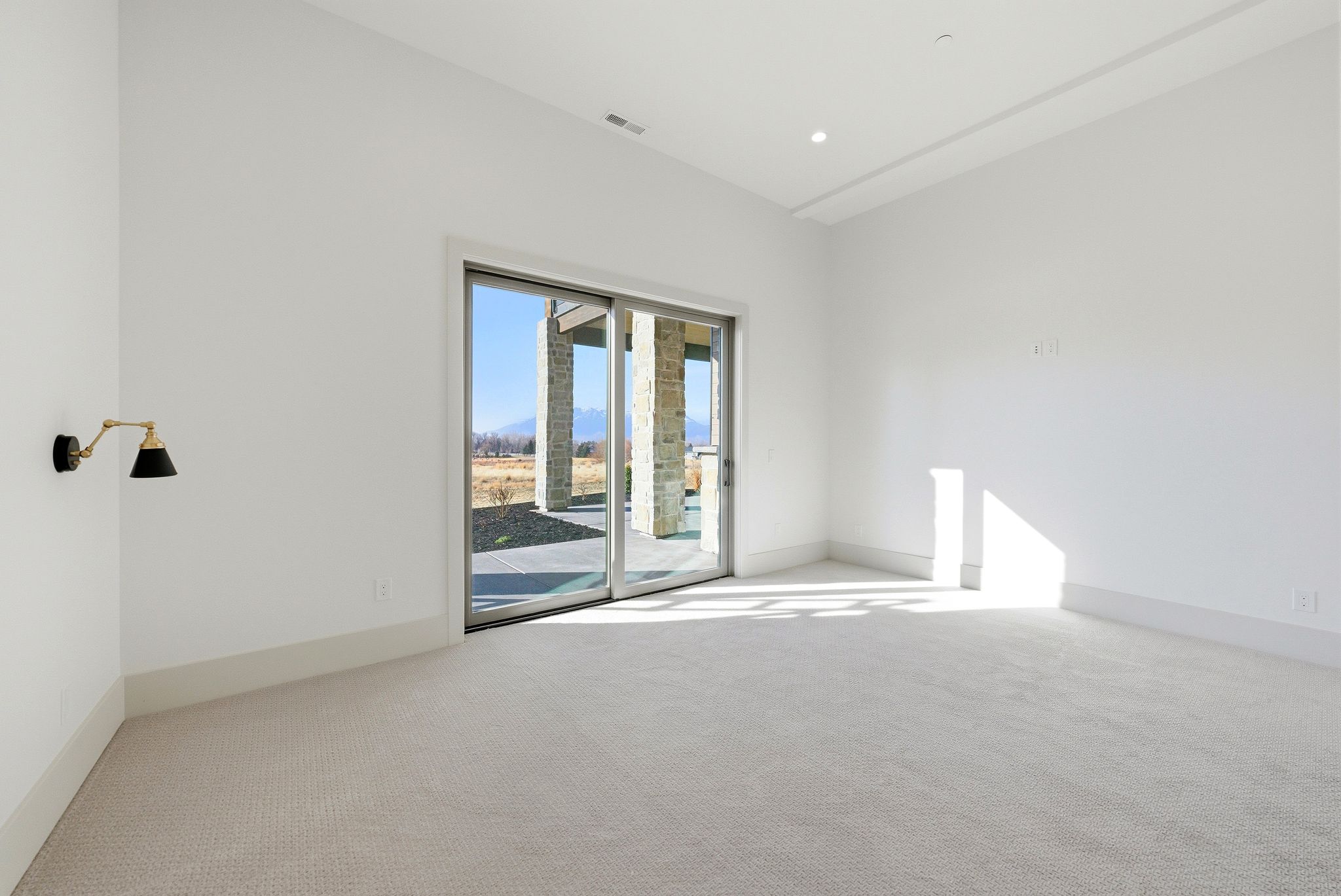 Empty room featuring carpet and baseboards