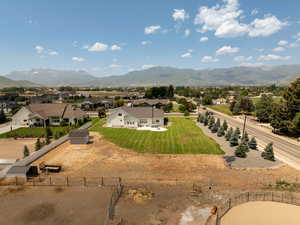 Aerial view of residential area featuring a mountain backdrop