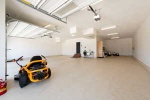 Garage featuring a garage door opener