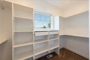 Spacious closet with carpet floors