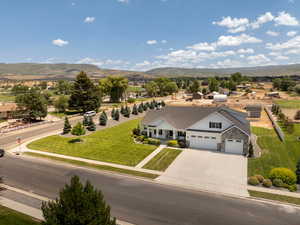 Aerial view of property and surrounding area with mountains
