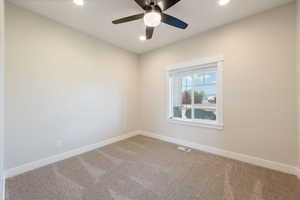 Unfurnished room featuring carpet floors, recessed lighting, and ceiling fan