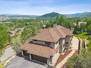 View from above of property with a mountain backdrop