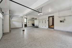 Garage featuring a garage door opener