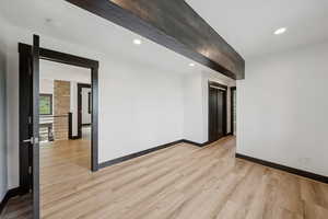 Spare room featuring light wood-style flooring, recessed lighting, and a smoke detector