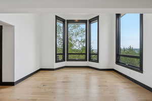 Spare room with light wood-style flooring