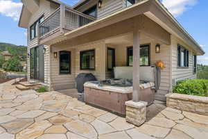 Patio / terrace featuring a patio area, a hot tub, and grilling area