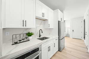 pic of model home of same floor plan, actual home may vary slightly on flooring, colors, cabinets, etc.