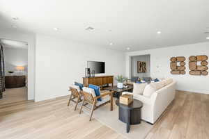 Living area featuring light wood-style flooring and recessed lighting.pic of model home of same floor plan, actual home may vary slightly on flooring, colors, cabinets, etc.
