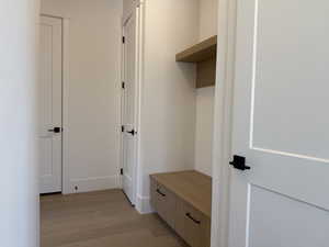 Mudroom featuring light wood-style floors