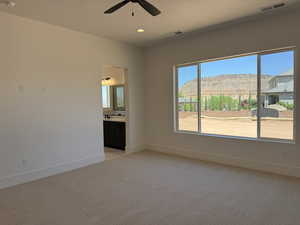 Spare room with light colored carpet, ceiling fan, a mountain view, recessed lighting, and a smoke detector