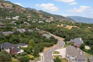 Aerial view of residential area featuring mountains