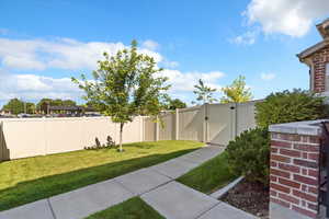Private Fenced yard featuring a gate