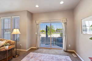 Entryway featuring carpet floors and recessed lighting