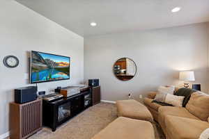 Living room with carpet floors and recessed lighting