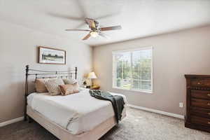 Bedroom featuring carpet and ceiling fan