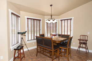 Dining room featuring a chandelier and lofted ceiling