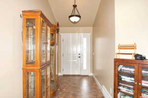 Foyer featuring baseboards and french doors
