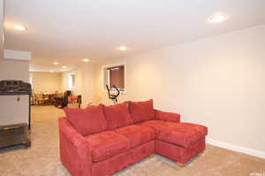 Living room featuring light colored carpet and recessed lighting